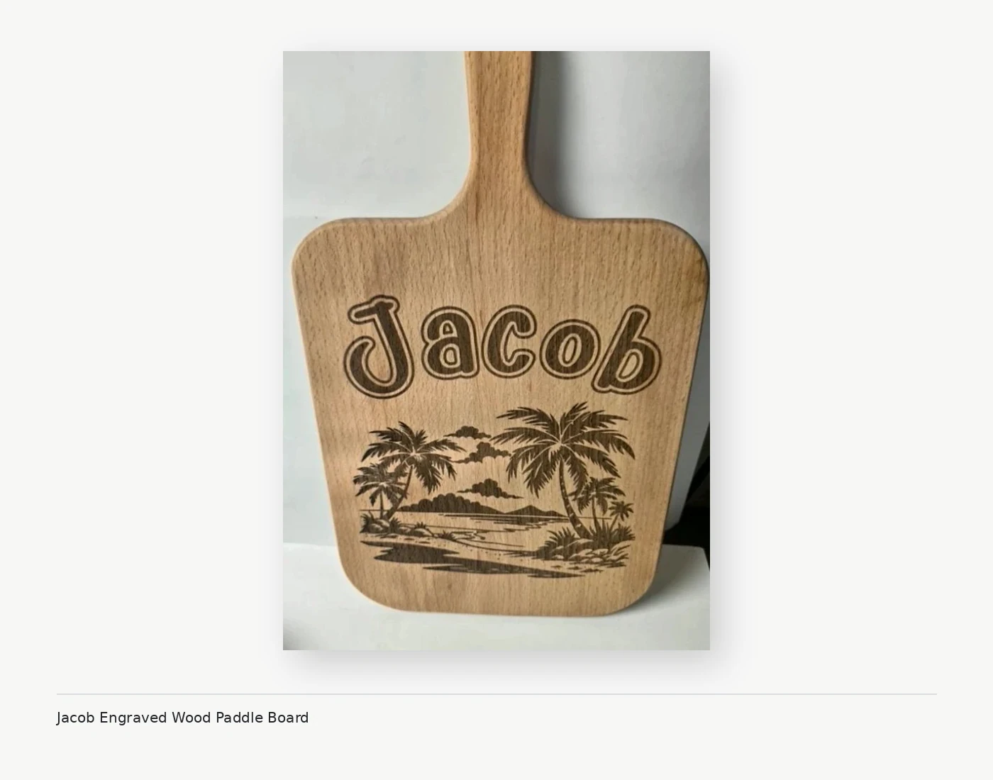 Personalized engraved wooden paddle board with Jacob name and tropical design
